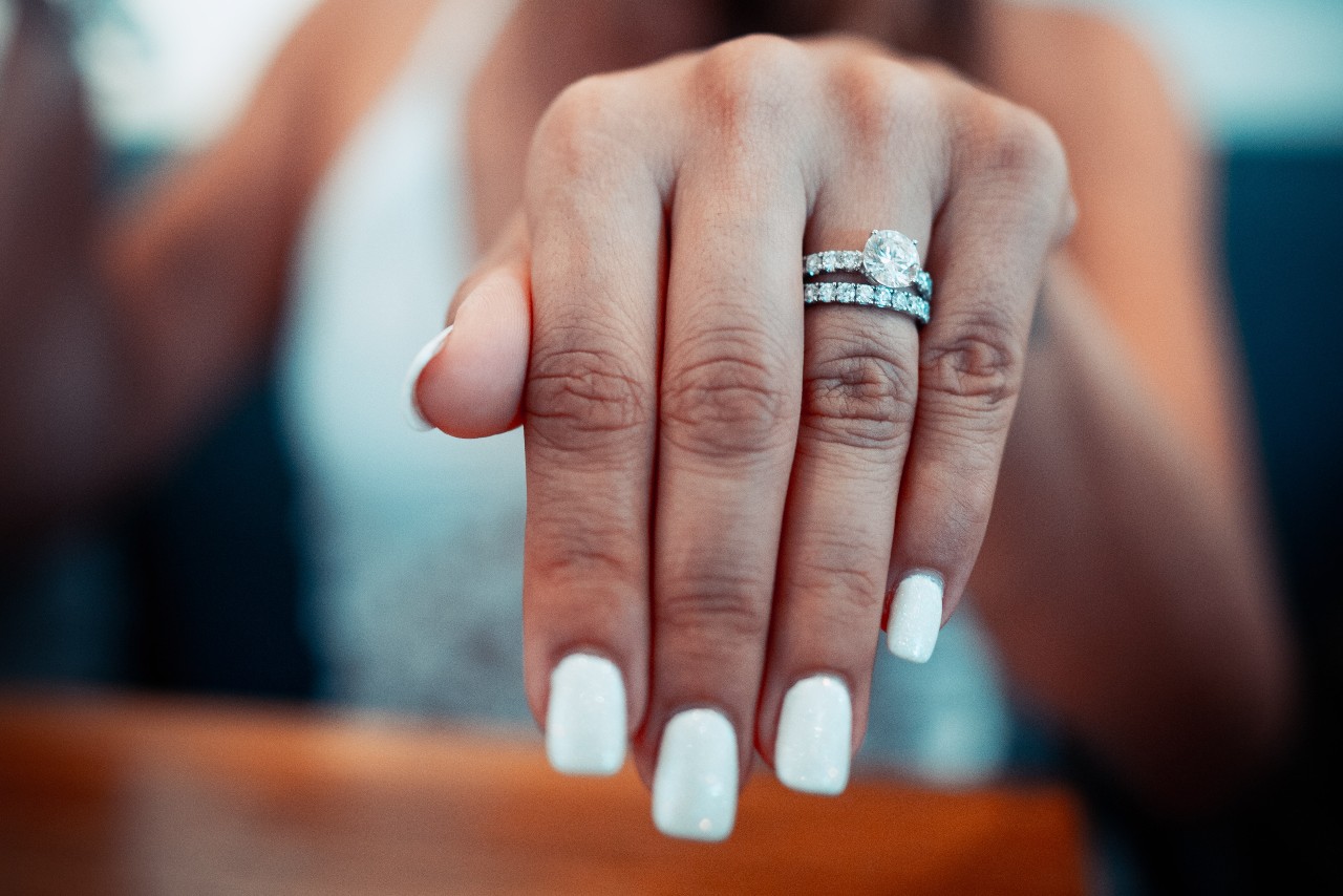 engagement ring and wedding ring on hand