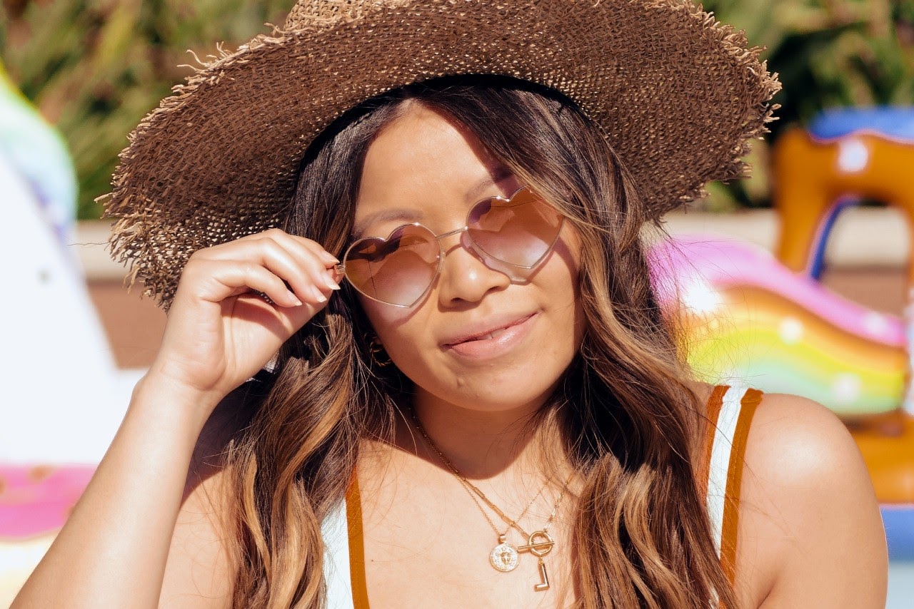 lady in sunglasses and hat