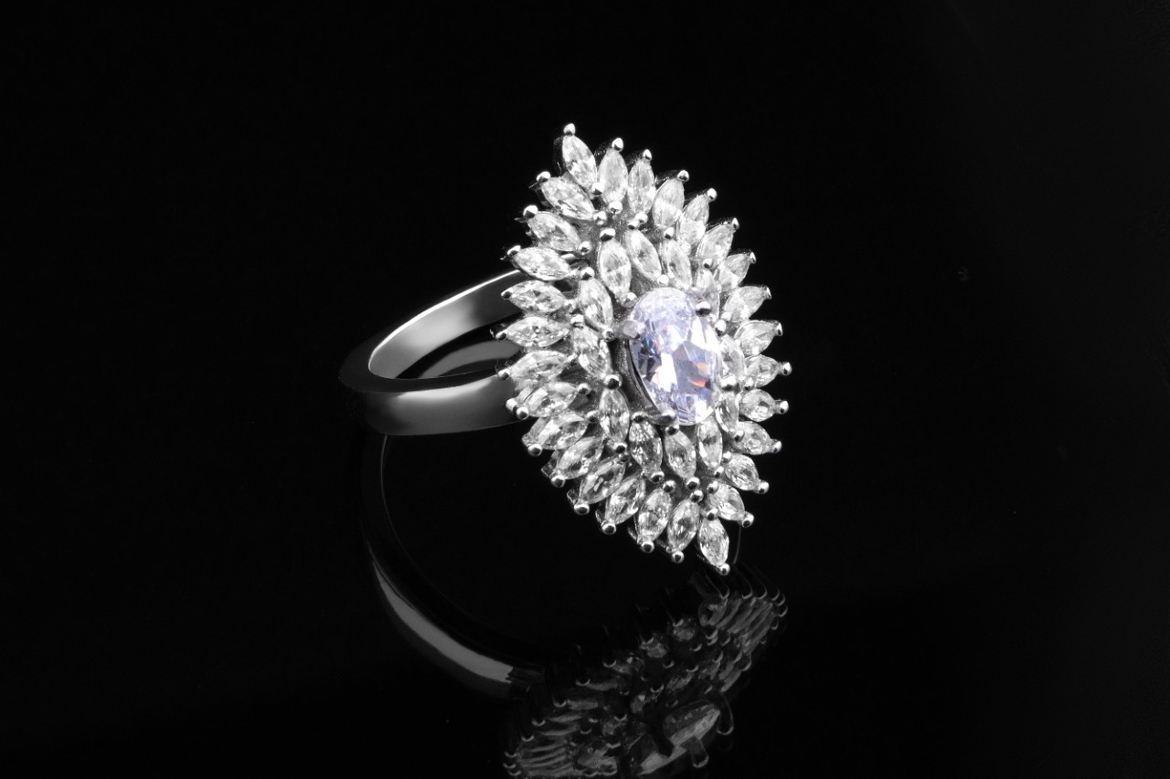 fashion ring with glittering diamonds and a unique halo setting