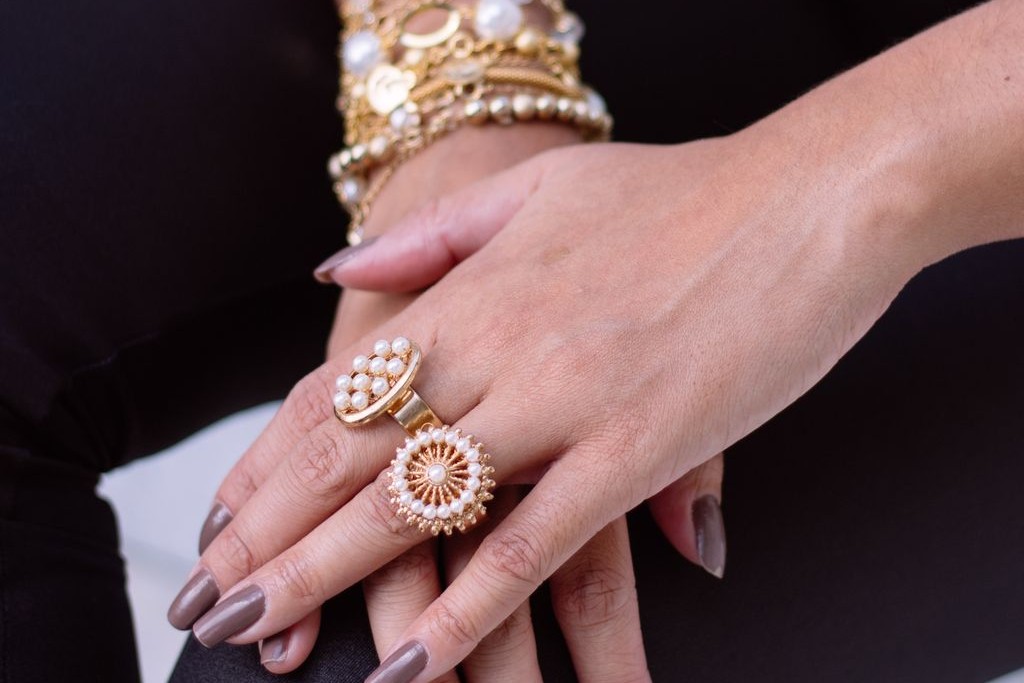 Bold pearl and yellow gold fashion rings and bracelets