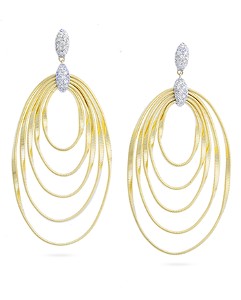 Multiple nesting yellow gold circles as drop earrings with white gold and diamond details