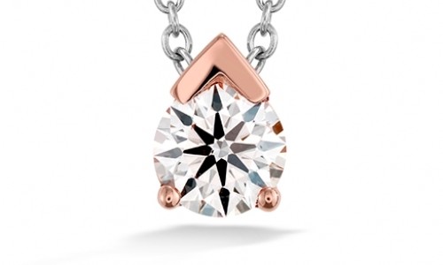 Rose and white gold necklace showcasing a brilliant diamond, made by Hearts On Fire