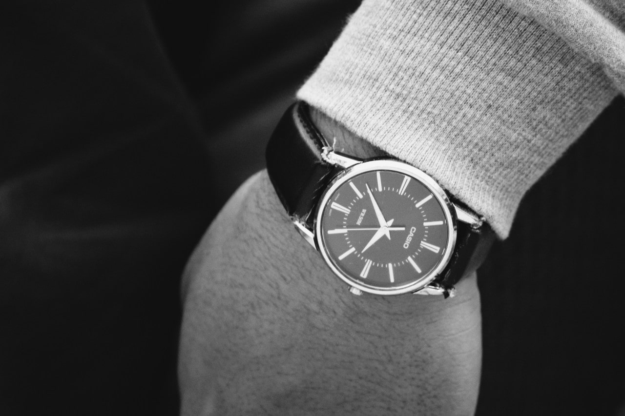 Black-and-white photo of a person wearing a timepiece
