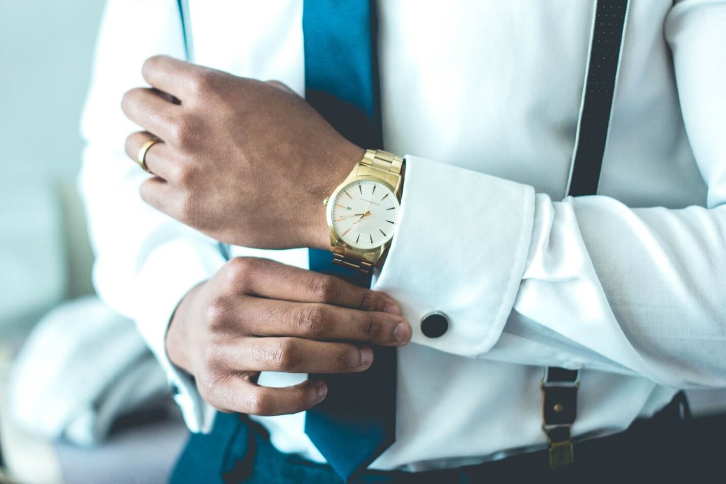 man with gold watch