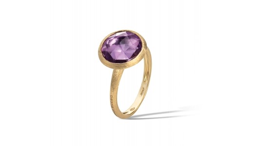 a yellow gold fashion ring with a round cut amethyst