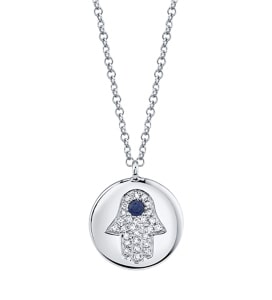 A hamsa motif featuring a sapphire on a white gold chain from Shy Creation.