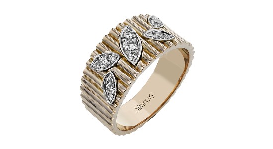 yellow gold statement ring with silver leaf motifs