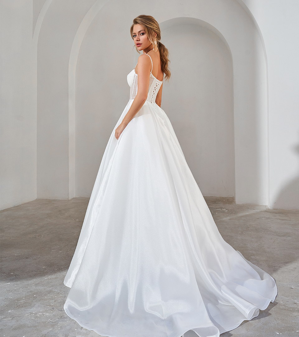 Bride standing in a white wedding dress Bride standing in a white wedding dress