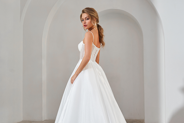 Bride standing in a white wedding dress Bride standing in a white wedding dress